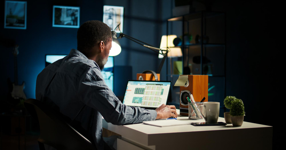 Freelance data analyst reviewing AI-generated data visualizations and SQL queries on a laptop